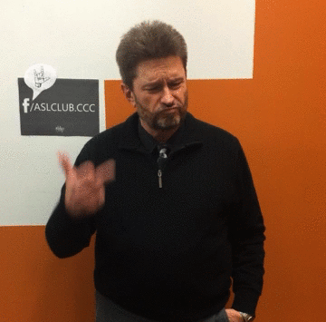 Peter Wujcik signs "Fuckin' A" in ASL