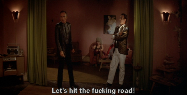 Blue Velvet: Dennis Hopper, standing next to Dean Stockwell in a red-painted apartment, says, "Let's hit the fucking road!"